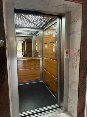 a pivot door in a room with wooden doors at River Park Studio in Sunny Beach