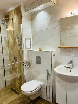 a bathroom with a shower and a toilet and a sink at Boutique Sozopol in Sozopol