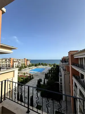 a view of a pool from a balcony of a building at Sea view Prestige Fort beach Apartment in Sveti Vlas