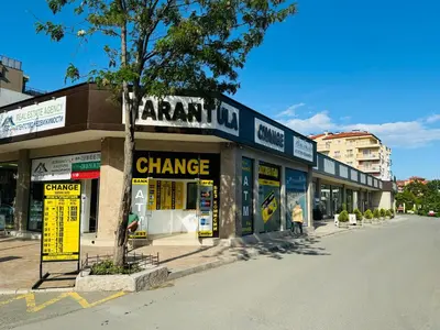 an empty street in a city with a store at GRAND KAMELIA B 2,8 Large Studio Sunny Beach in Sunny Beach