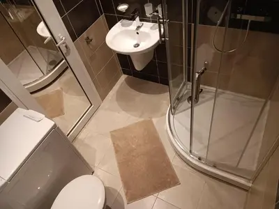 a bathroom with a shower and a toilet and a sink at Royal Palm Studio, Sveti Vlas in Sveti Vlas