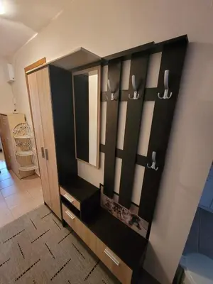 a bathroom with a black cabinet with a mirror at Prestige Fort Beach apartment in Sveti Vlas