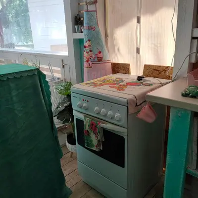 a kitchen with a green stove and a counter at каравана ТРОПИК-ЕКЗОТИК А 17 in Sozopol