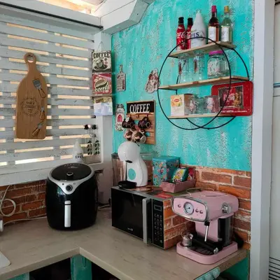 a kitchen with a counter with a microwave on a table at каравана ТРОПИК-ЕКЗОТИК А 17 in Sozopol