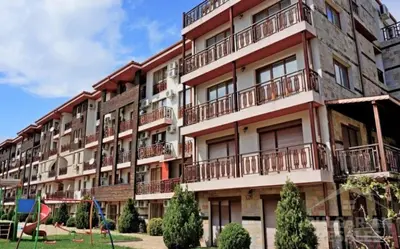 an apartment building with balconies on the side of it at GreenStudio w Sveti Vlas in Sveti Vlas