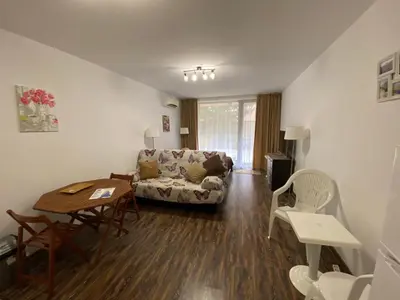 a living room with a couch and a table at Studio Kristina in Pomorie
