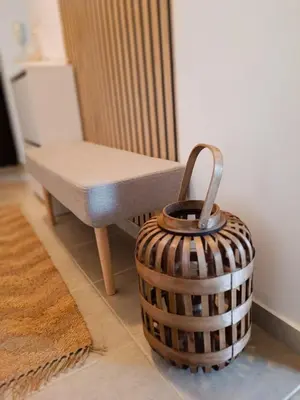 a wicker basket next to a chair and a table at Bulgapart Obzor in Obzor