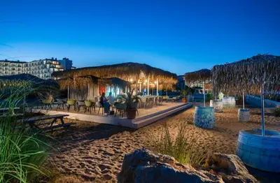 a restaurant on the beach at night at Bulgapart Obzor in Obzor