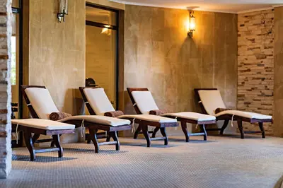 a row of chairs in a waiting room at The Cliff Hotel and Holiday Apartments by Flat Mаnаger in Obzor