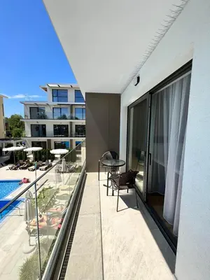 an apartment balcony with a view of a swimming pool at Double studio Petra B2-5 in Byala