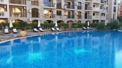 a large swimming pool in front of a building at Menada Kalia Apartments in Sunny Beach