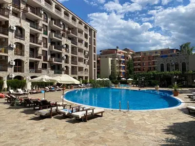 a large swimming pool in front of a building at Menada Kalia Apartments in Sunny Beach