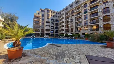 a large swimming pool in front of a building at Menada Kalia Apartments in Sunny Beach