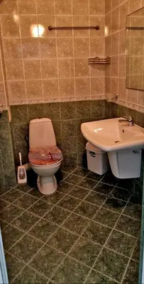 a bathroom with a toilet and a sink at Амон Ра in Primorsko