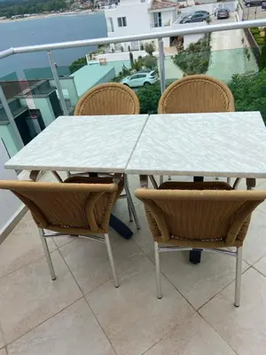 a white table and chairs on a balcony at 2 Bed Suite, Exclusive Sea Views in Sozopol