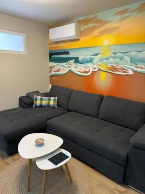 a living room with a couch and a table at Sea Treasure in Varna City
