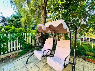a group of chairs sitting next to a fence at Vacation apartments Daneli in Sunny Beach
