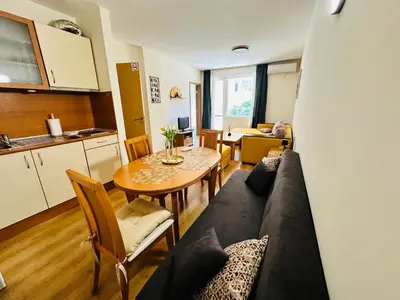 a living room with a couch and a table at Vacation apartments Daneli in Sunny Beach