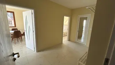 an open door to a room with a dining room at Zigrabay lovely appartments in Primorsko