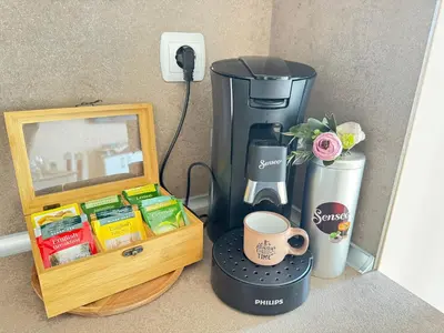 a coffee maker next to a box with a coffee maker at MaYana Beach Appartament in Burgas City