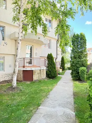a walkway in front of a building with a porch at MaYana Beach Appartament in Burgas City