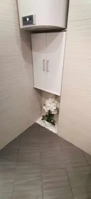 a view of a bathroom with flowers on the floor at Апартамент Панорама Славейков in Burgas City