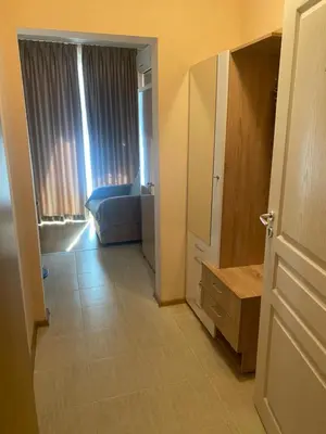 a room with a bedroom with a bed and a door at MESSEMBRIA RESORT apartament B503 in Sunny Beach