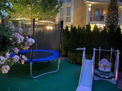 a playground with a slide and a swing set at MESSEMBRIA RESORT apartament B503 in Sunny Beach