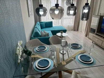 a living room with a glass table and a couch at Elizi summer house in Varna South Bay Beach in Varna City