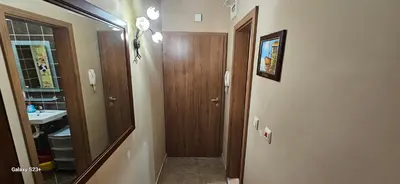 a small bathroom with a sink and a mirror at Частно студио в комплекс Поморие Ризорт in Pomorie