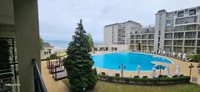 a view of a large swimming pool in a building at Частно студио в комплекс Поморие Ризорт in Pomorie