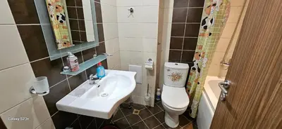 a small bathroom with a sink and a toilet at Частно студио в комплекс Поморие Ризорт in Pomorie