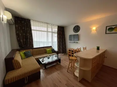 a living room with a couch and a table at Grenada - Apartments by the beach in Sunny Beach