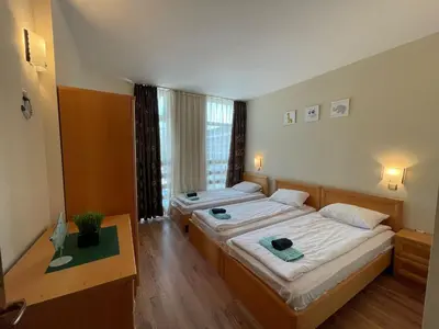a bedroom with two beds and a window at Grenada - Apartments by the beach in Sunny Beach