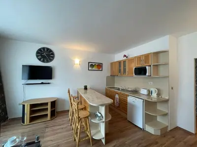 a small kitchen with a table and a counter at Grenada - Apartments by the beach in Sunny Beach