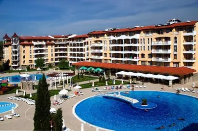 a resort with a large swimming pool and buildings at Royal Sun - Premium Apartments in Sunny Beach