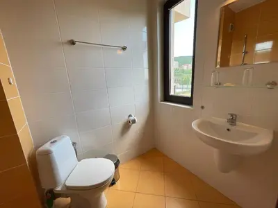 a bathroom with a toilet and a sink at Macon Residence - Premium Apartments in Sveti Vlas