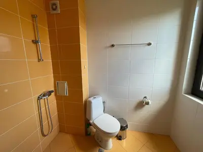a bathroom with a toilet and a shower at Macon Residence - Premium Apartments in Sveti Vlas