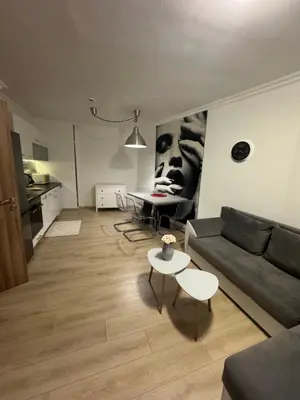 a living room with a couch and a table at Gold Coast SP apartments in Burgas City