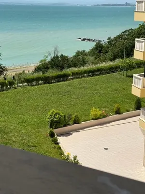 a view of the ocean from the balcony of a house at Gold Coast SP apartments in Burgas City