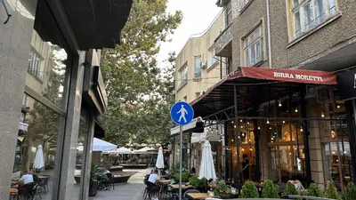 a street with a street sign in front of a building at Spacious Apartment in Central Burgas in Burgas City