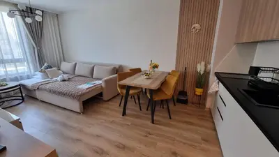a living room with a couch and a table at Sorrento Sole Mare V&D Luxury Style Apartment in Sveti Vlas