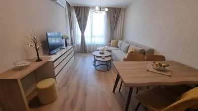 a living room with a couch and a table at Sorrento Sole Mare V&D Luxury Style Apartment in Sveti Vlas