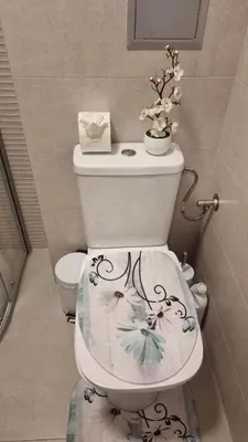 a bathroom with a toilet with a flower design on it at Sorrento Sole Mare V&D Luxury Style Apartment in Sveti Vlas