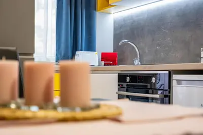 a kitchen with a counter top with a sink at Apartment Linda Cosy Getaway in Varna City