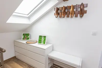 a skylight in a attic room with a dresser at The Central House 3 in Burgas City