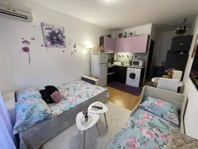 a small living room with a couch and a kitchen at Студио Sunny Day 6 Sunny beach in Sunny Beach