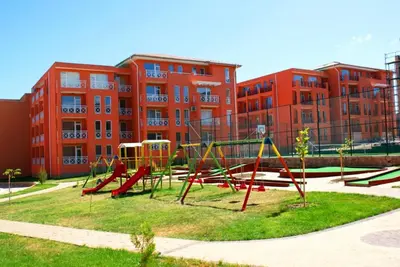 an empty playground in front of a building at Студио Sunny Day 6 Sunny beach in Sunny Beach