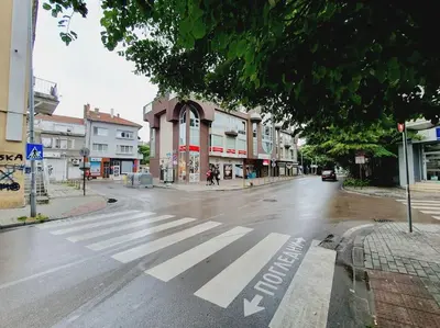 an empty street with a crosswalk in a city at Mateo Center in Varna City