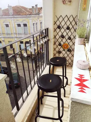 two black stools sitting on a balcony at Astell Superior Studio in Burgas City